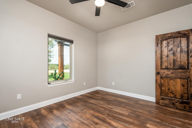 empty room featuring dark hardwood / wood-style floors and ceiling fan