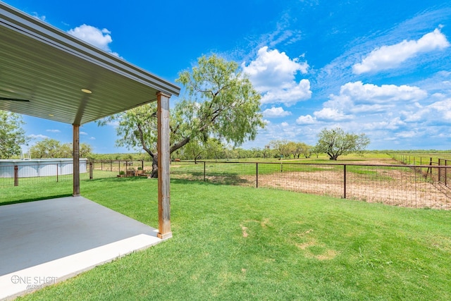 view of yard with a patio area and a rural view