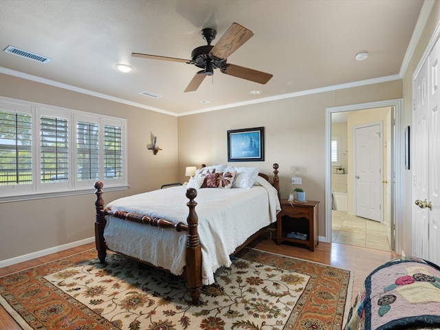 bedroom with light tile patterned flooring, connected bathroom, ornamental molding, and ceiling fan