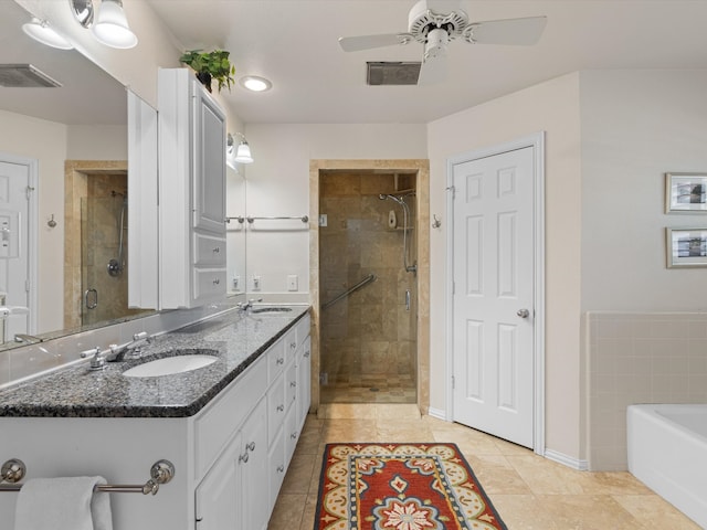 bathroom with separate shower and tub, ceiling fan, double sink vanity, and tile patterned flooring