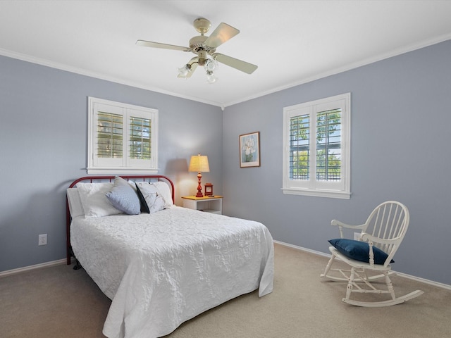 bedroom with crown molding, ceiling fan, and carpet