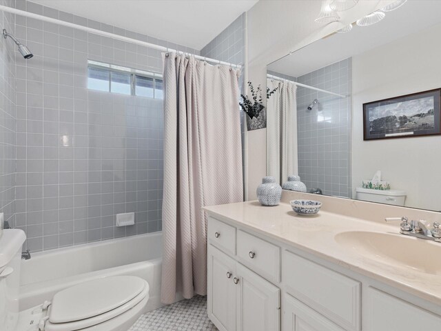 full bathroom featuring vanity, toilet, tile patterned flooring, and shower / tub combo