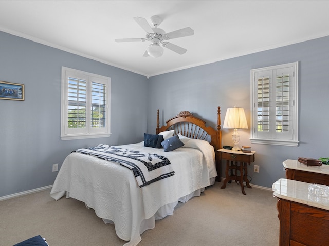 bedroom with light carpet, ornamental molding, and ceiling fan