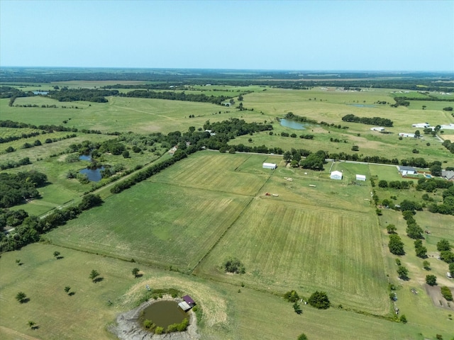 drone / aerial view with a water view and a rural view