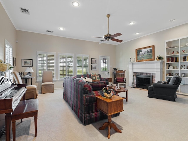 living room with ornamental molding, plenty of natural light, a brick fireplace, and light carpet