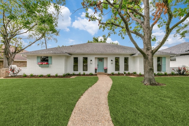 single story home with a front yard