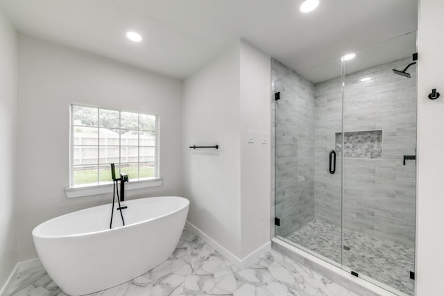 bathroom with tile patterned flooring and independent shower and bath