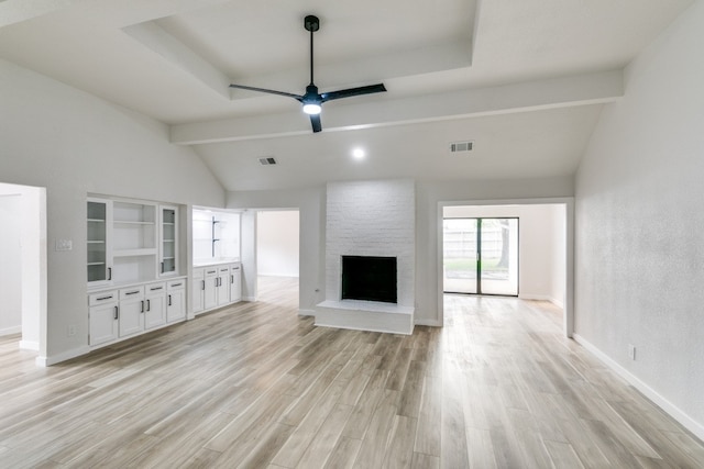 unfurnished living room with a fireplace, vaulted ceiling with beams, light hardwood / wood-style flooring, and ceiling fan