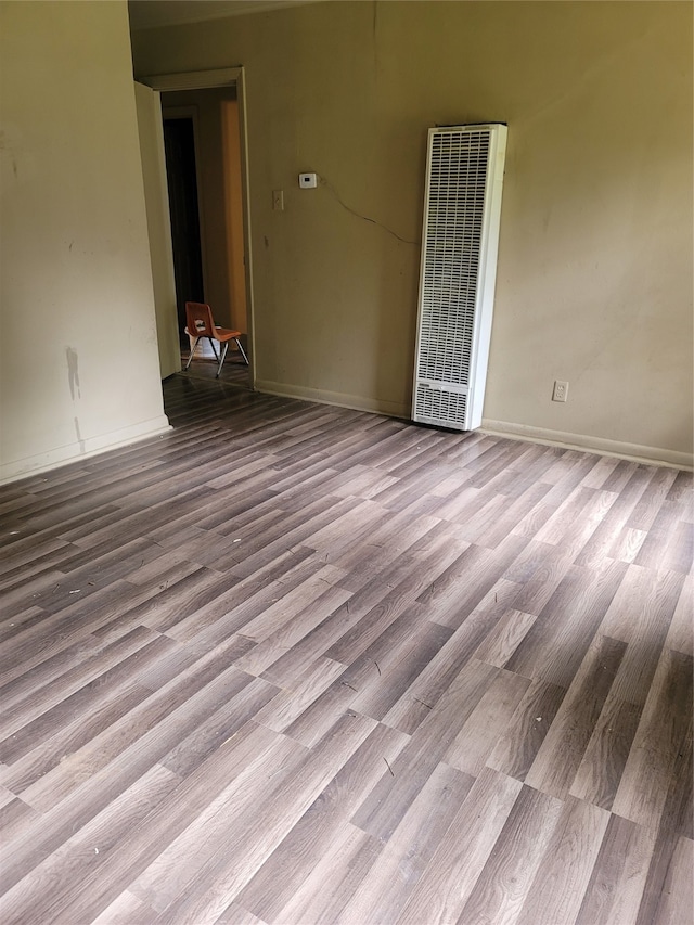 empty room with hardwood / wood-style flooring