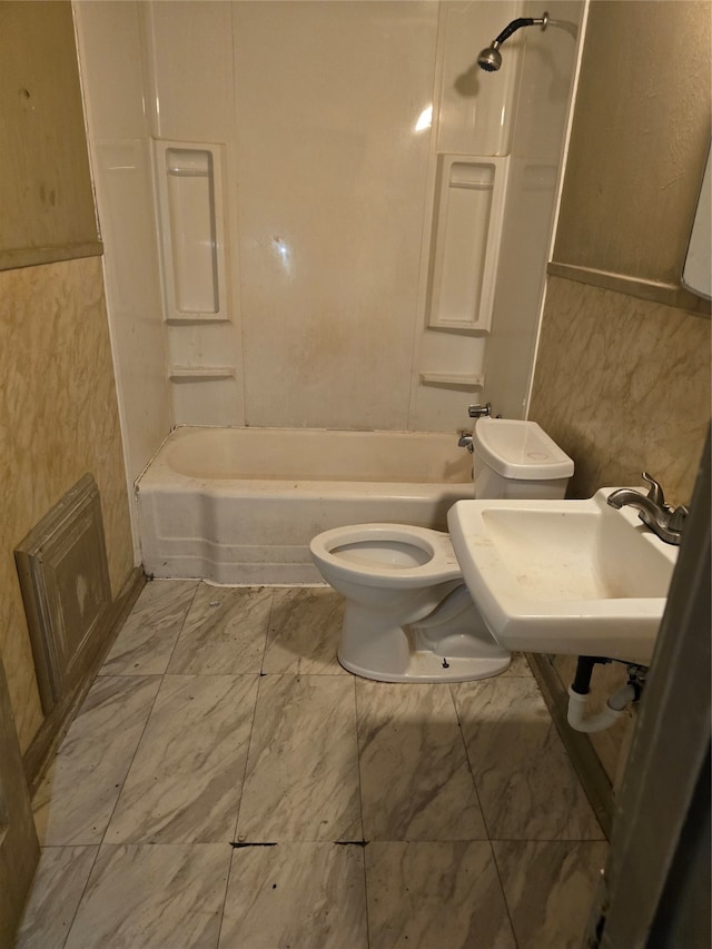 full bathroom featuring tile patterned flooring, toilet, and shower / bath combination