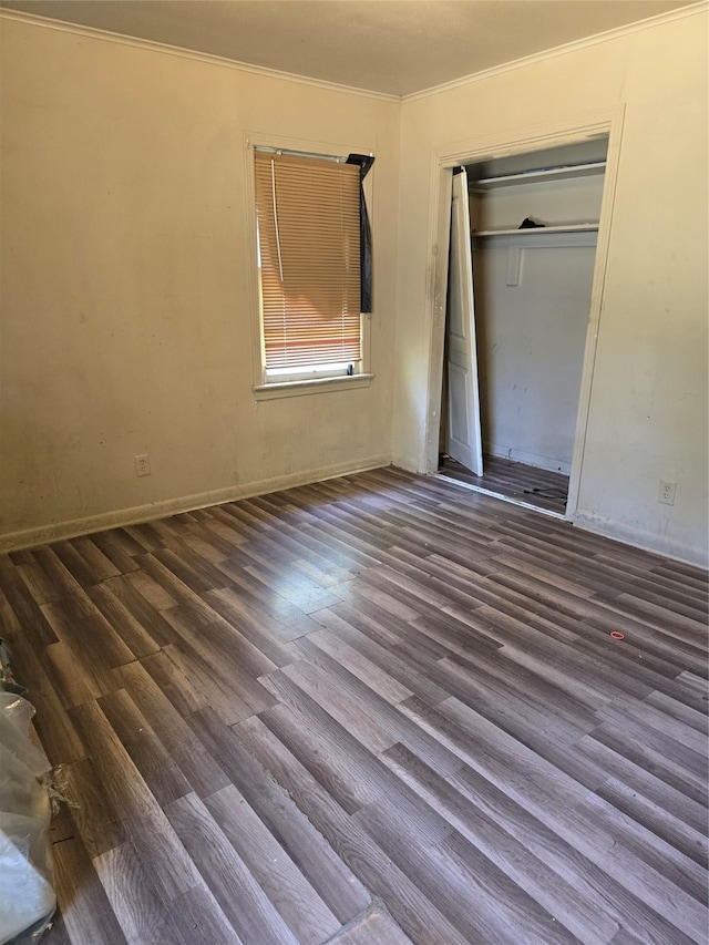 unfurnished bedroom featuring wood-type flooring and a closet