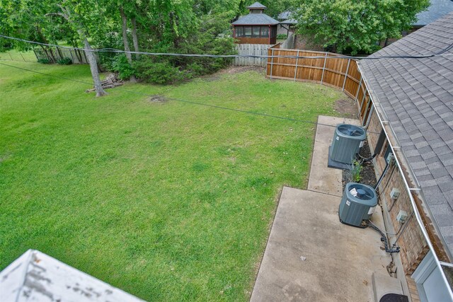 view of yard featuring central AC