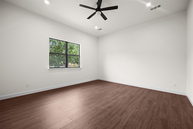 empty room with ceiling fan and hardwood / wood-style flooring