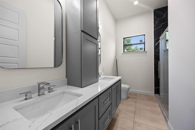 1057 Meadow Hill Dr, Lavon, TX 75166 - full bath featuring double vanity, toilet, tile patterned flooring, baseboards, and a shower