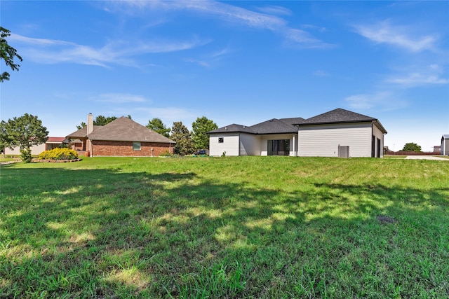 1057 Meadow Hill Dr, Lavon, TX 75166 - view of green lawn with a garage