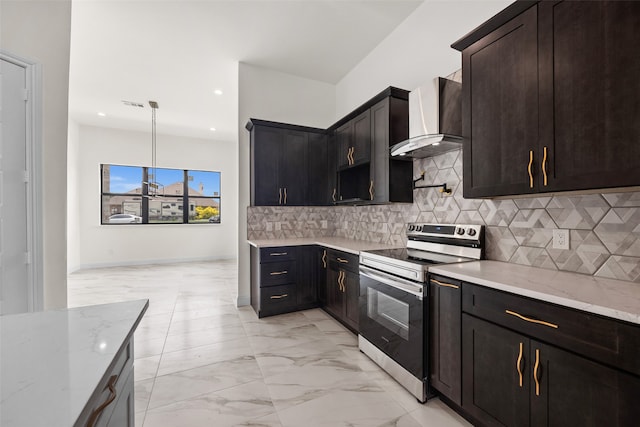 kitchen with electric range, tasteful backsplash, wall chimney range hood, light stone counters, and pendant lighting