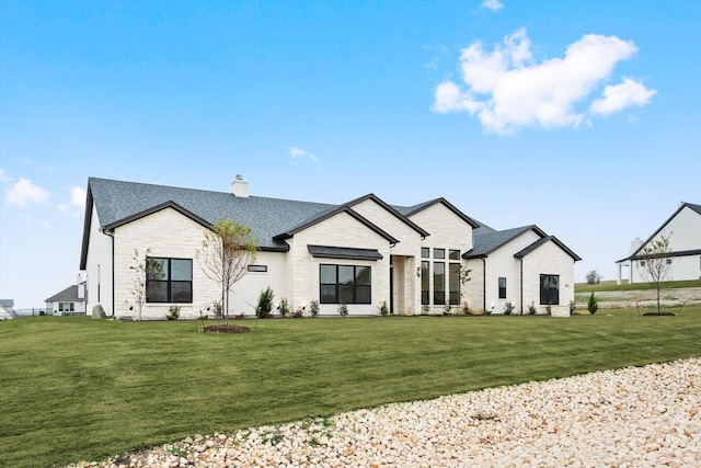 modern farmhouse with a front yard