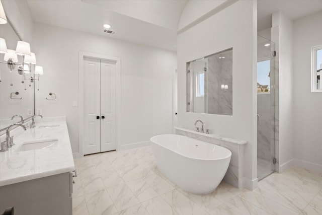 bathroom with vanity and separate shower and tub