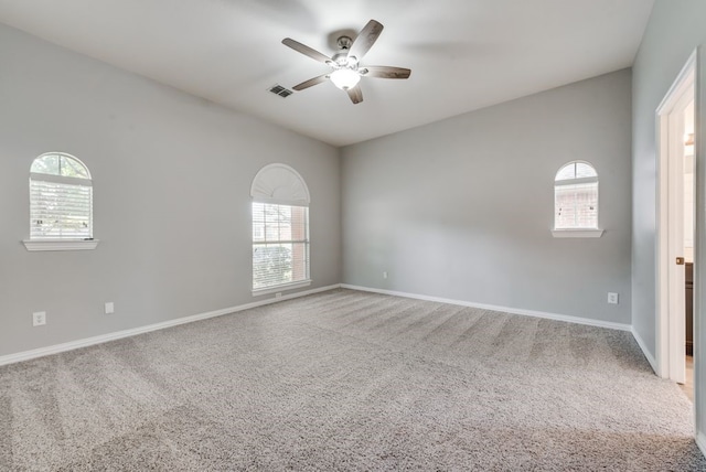 carpeted empty room with ceiling fan