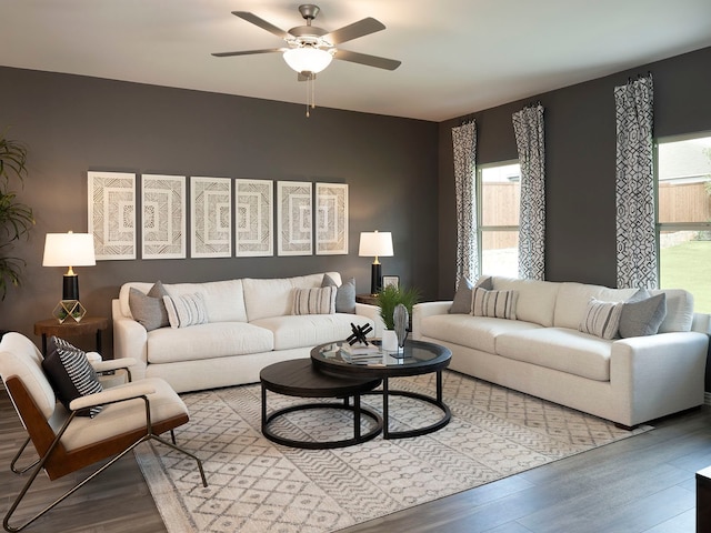 living room featuring ceiling fan and hardwood / wood-style flooring