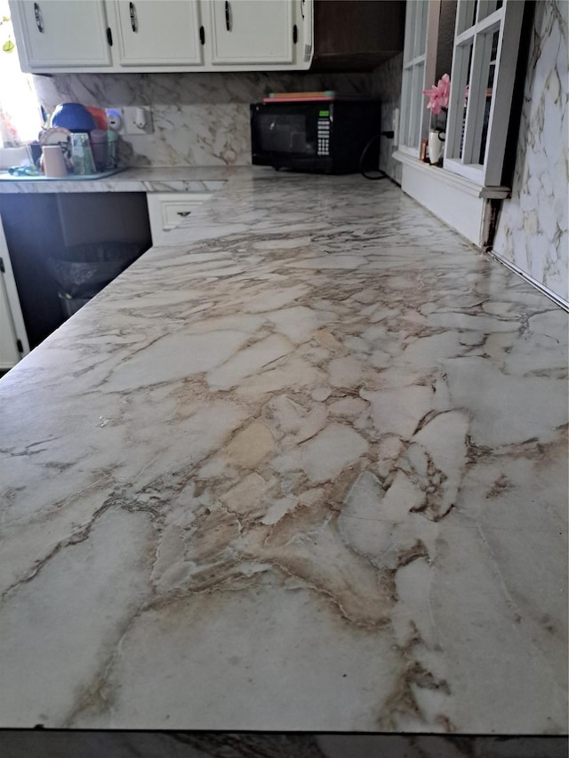 kitchen with white cabinets