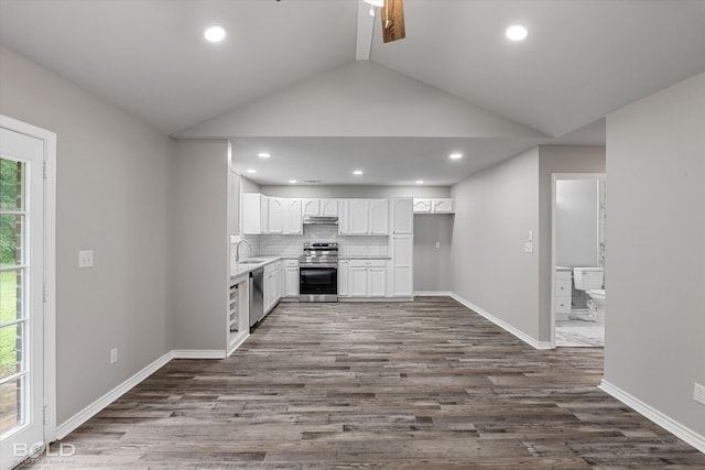 kitchen with stainless steel appliances, dark hardwood / wood-style floors, white cabinetry, and a healthy amount of sunlight