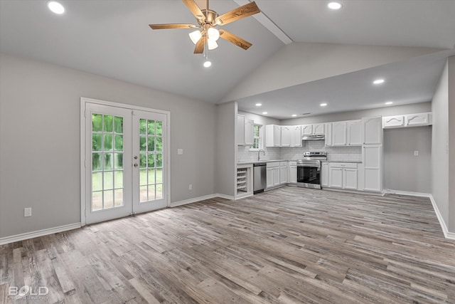 unfurnished living room featuring french doors, light wood-type flooring, high vaulted ceiling, sink, and ceiling fan