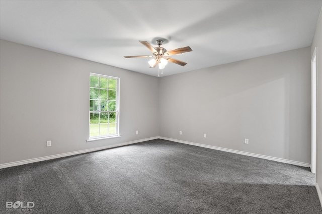 carpeted empty room featuring ceiling fan