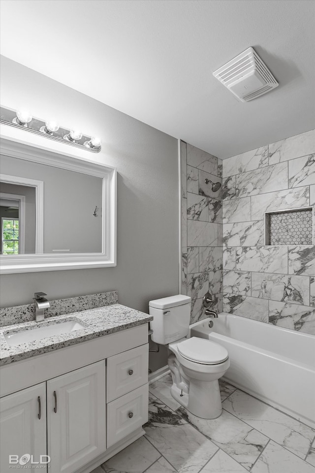 full bathroom featuring tiled shower / bath combo, vanity, and toilet