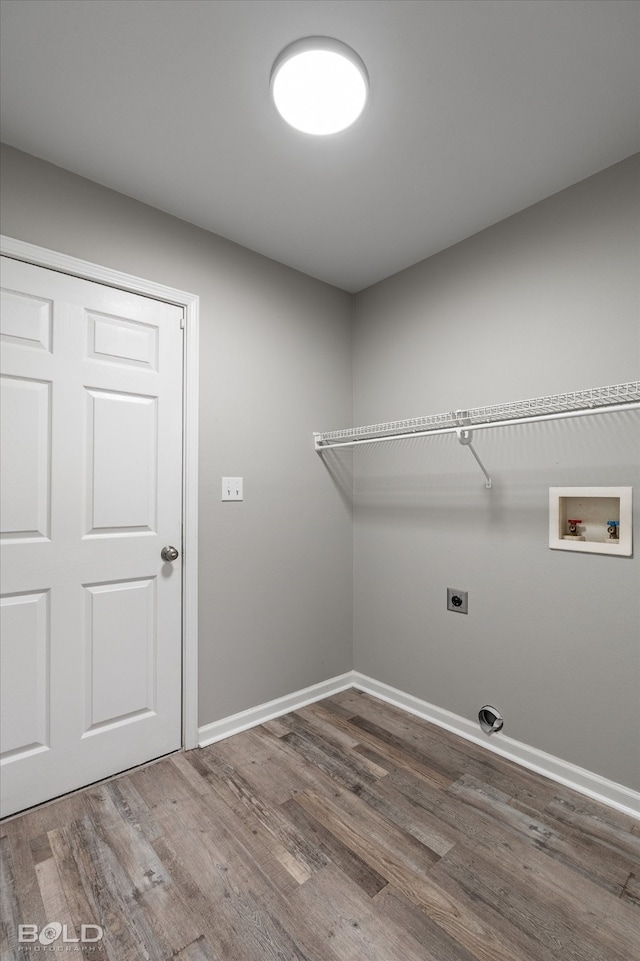 washroom featuring hookup for a washing machine, wood-type flooring, and electric dryer hookup