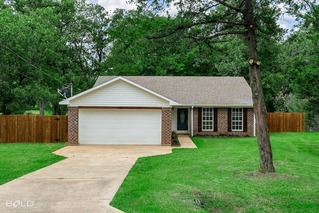 single story home featuring a garage and a front yard