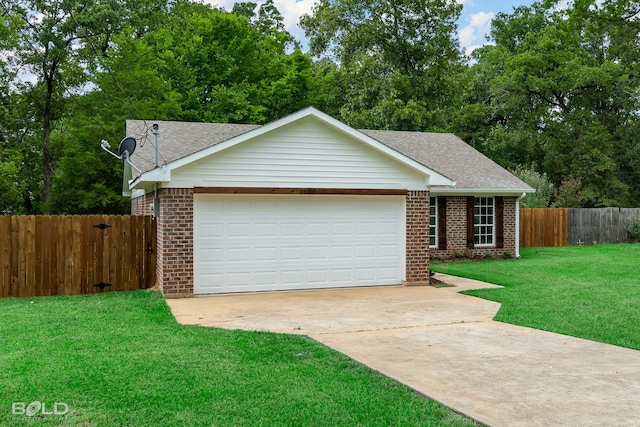 ranch-style home featuring a garage and a front lawn