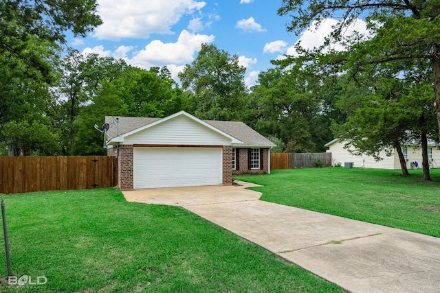 ranch-style home featuring a garage and a front yard