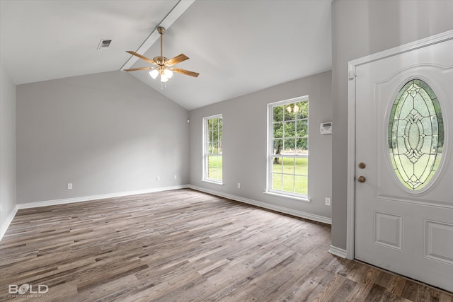 foyer featuring light wood-type flooring, ceiling fan, and vaulted ceiling