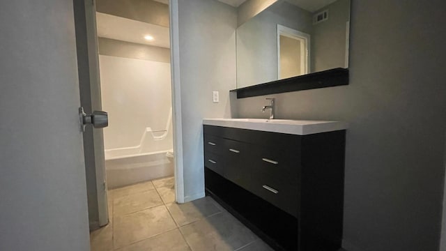 full bathroom with tile patterned floors, vanity, bathtub / shower combination, and toilet