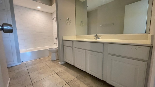 full bathroom with tile patterned flooring, vanity, toilet, and tiled shower / bath