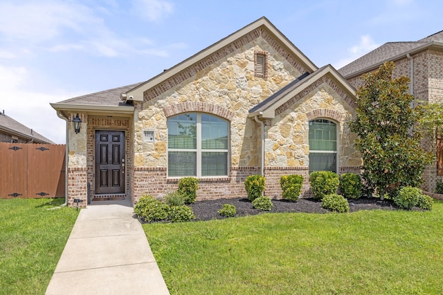 view of front of property with a front lawn