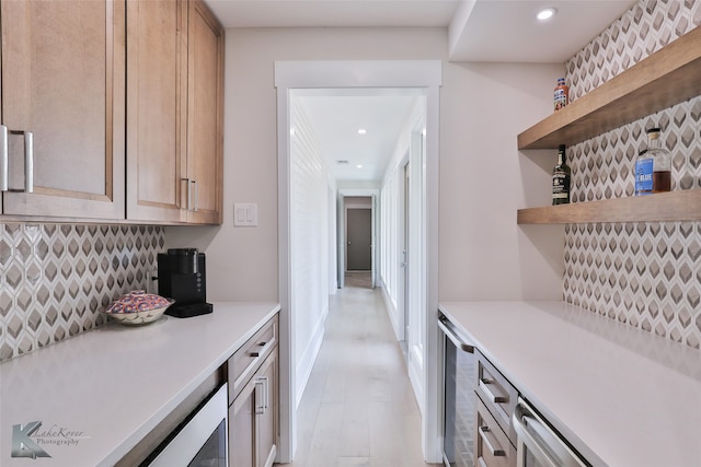 kitchen featuring light hardwood / wood-style flooring and tasteful backsplash