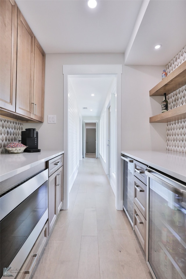 kitchen featuring decorative backsplash, light tile patterned floors, and wine cooler