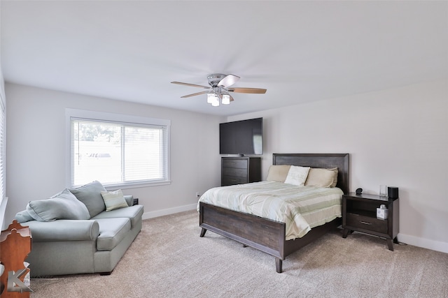 bedroom featuring light colored carpet and ceiling fan