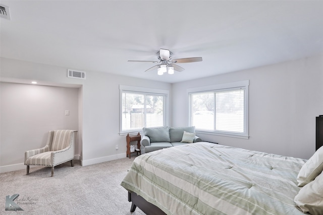 carpeted bedroom with ceiling fan