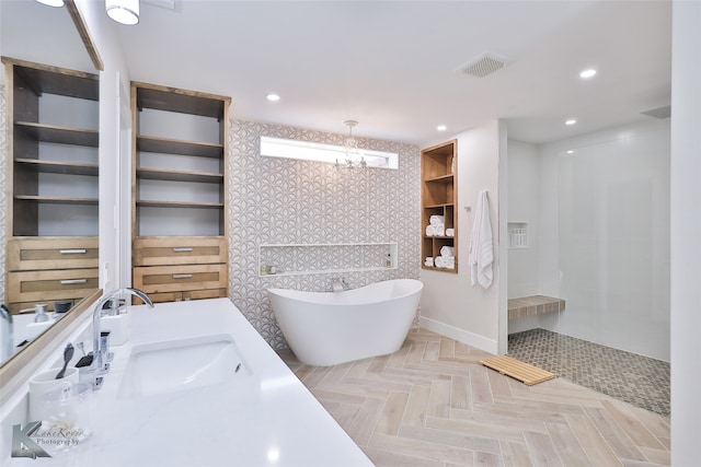 bathroom with parquet flooring and a bath