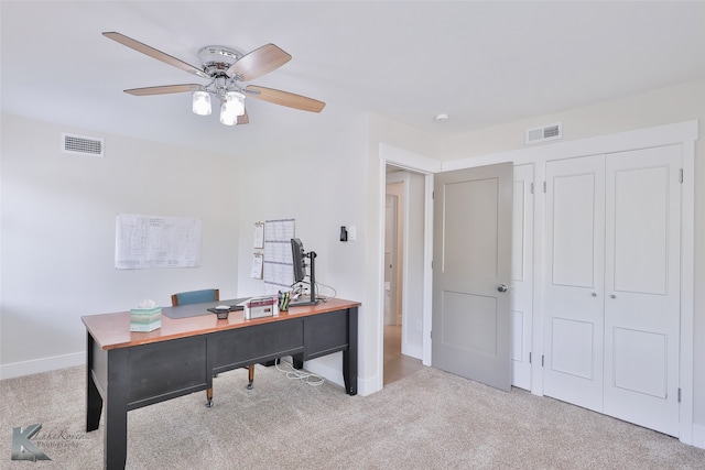 carpeted office with ceiling fan