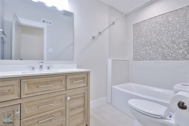 full bathroom featuring tile patterned floors, vanity, tiled shower / bath combo, and toilet