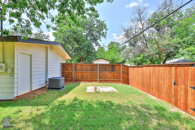 view of yard with central AC