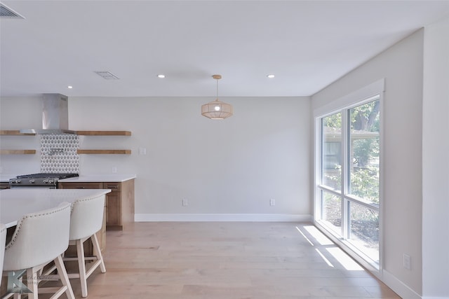 unfurnished dining area with light hardwood / wood-style floors