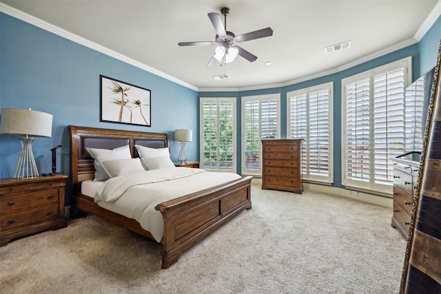 bedroom featuring light colored carpet, ceiling fan, and crown molding