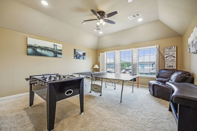 playroom with ceiling fan, light carpet, and lofted ceiling