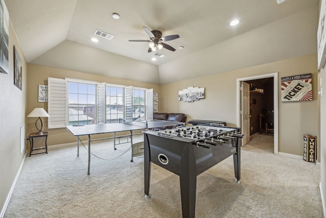 recreation room with ceiling fan, light colored carpet, and lofted ceiling