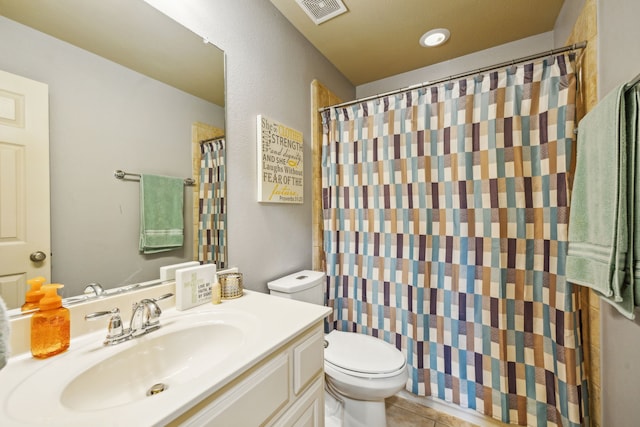 bathroom with tile patterned floors, vanity, toilet, and a shower with curtain